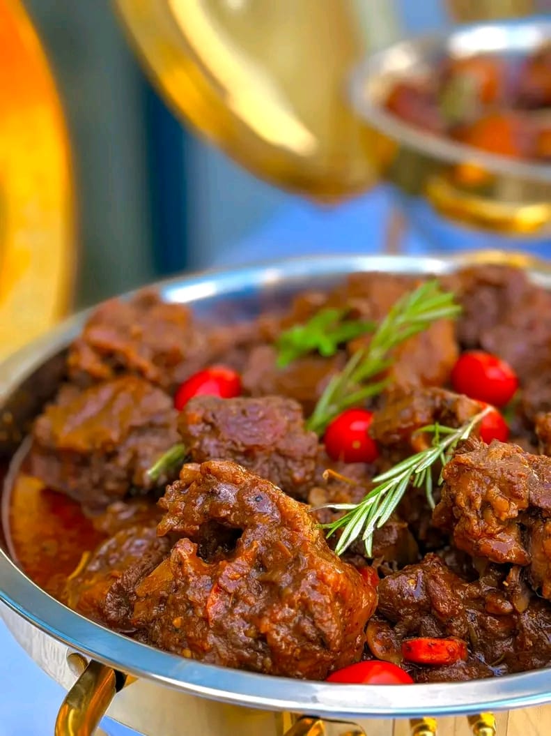 Rich beef stew with rosemary and cherry tomatoes