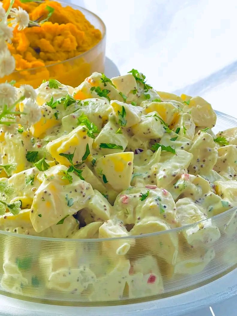Creamy potato salad in a glass bowl
