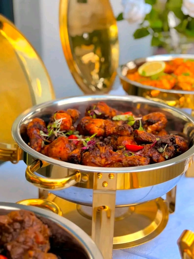 Chicken wings in a gold chafing dish